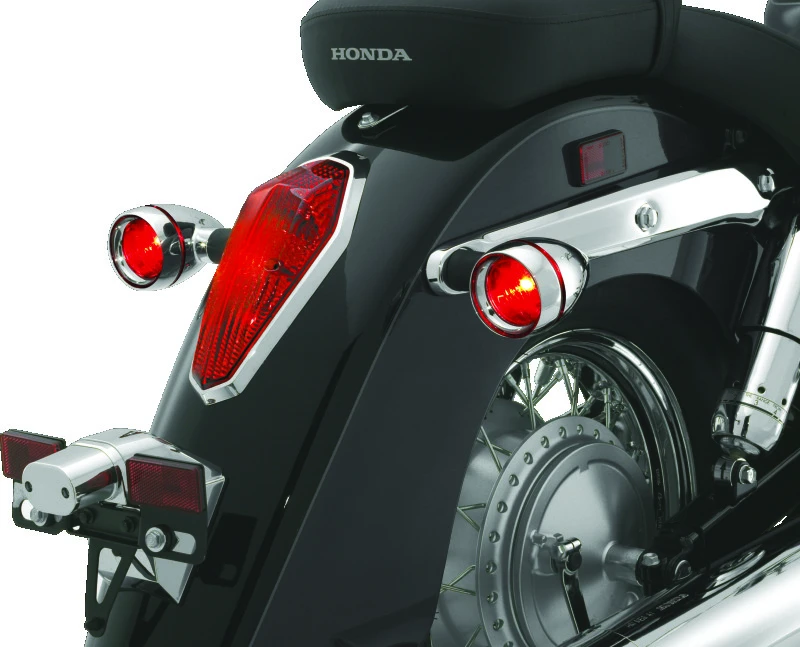 Kuryakyn Deep Dish Bezels mit roten Linsen
