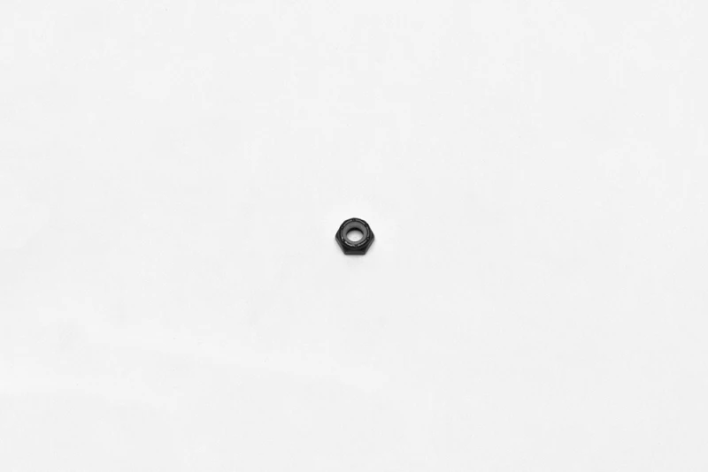 Wilwood nut 1/4-28 thin nylock 7/16 hex black zinc