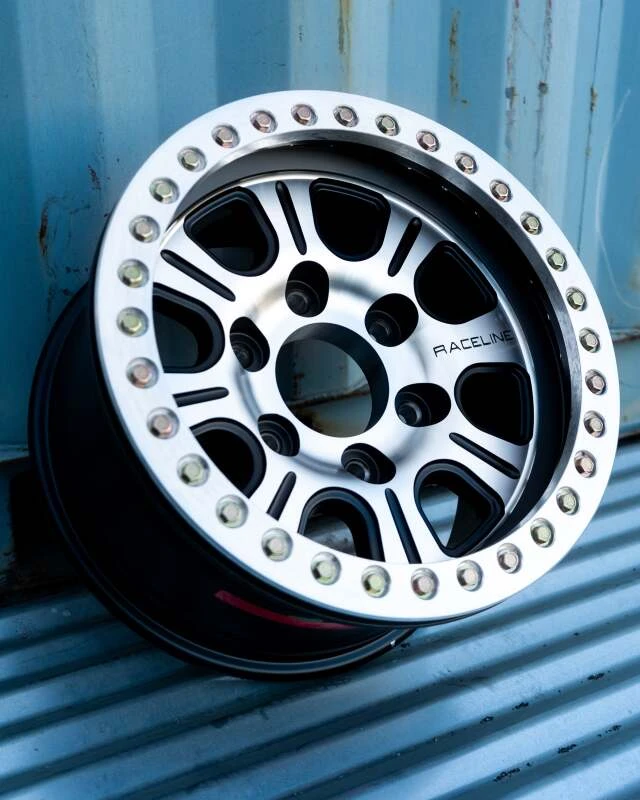 Raceline RT232 Monster 17x8.5in/8x165.1 BP/-25mm Offset/130.81mm Bore - Black & MACH. Beadlock Wheel