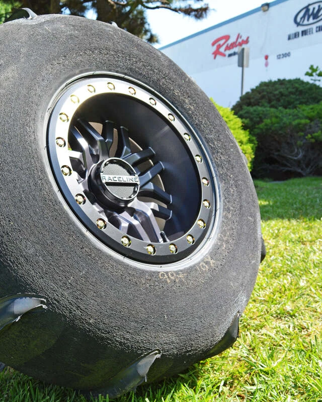 Raceline A91G Ryno 15x7in/4x156 BP/10mm Offset/132.5mm Bore - Gunmetal & Black Ring Beadlock Wheel
